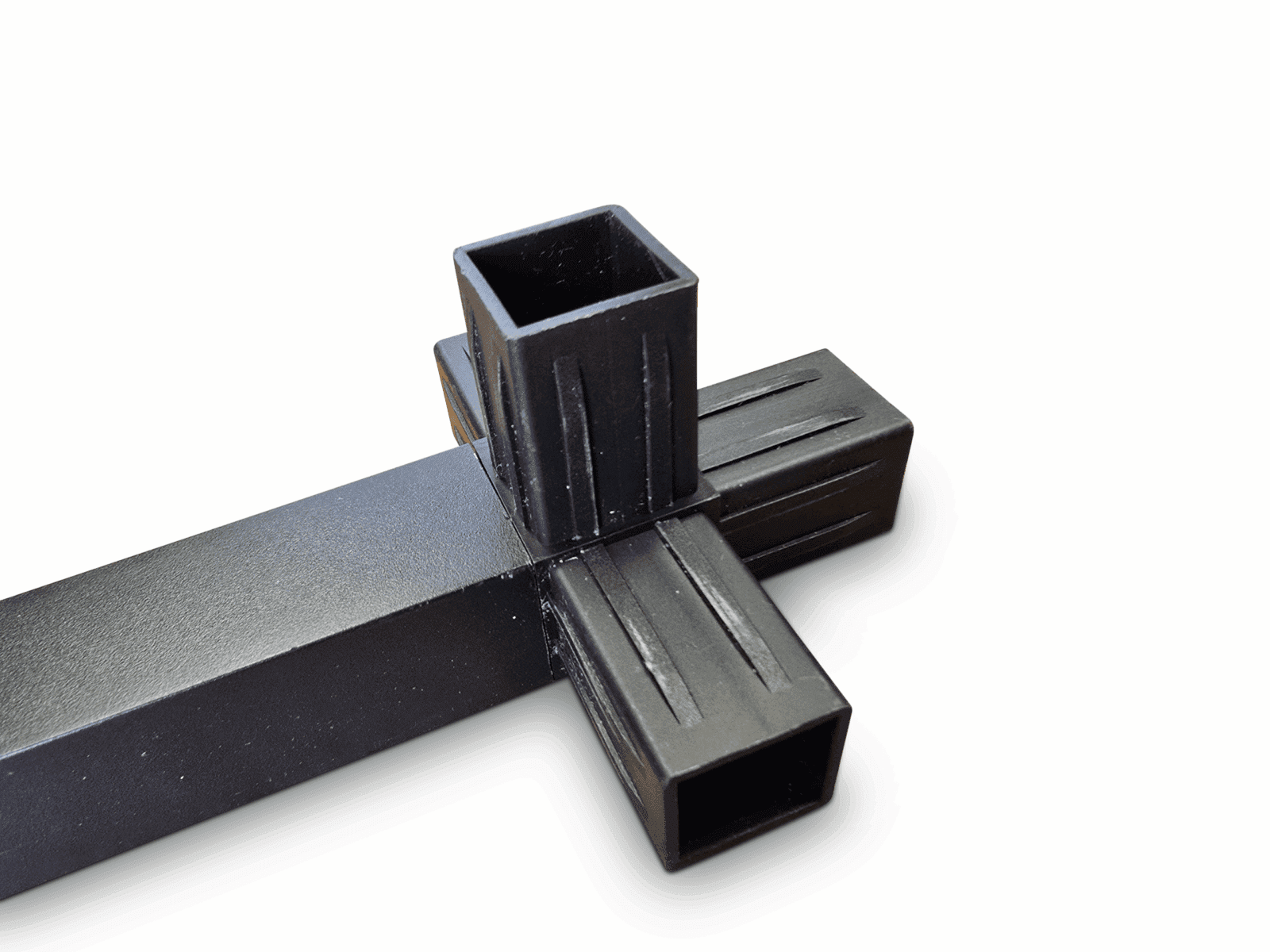 Black metal T-joint connector for rectangular tubing with textured surface and vertical lines.