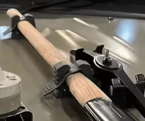Rubber Grip Clamps Securing Handle Of Shovel