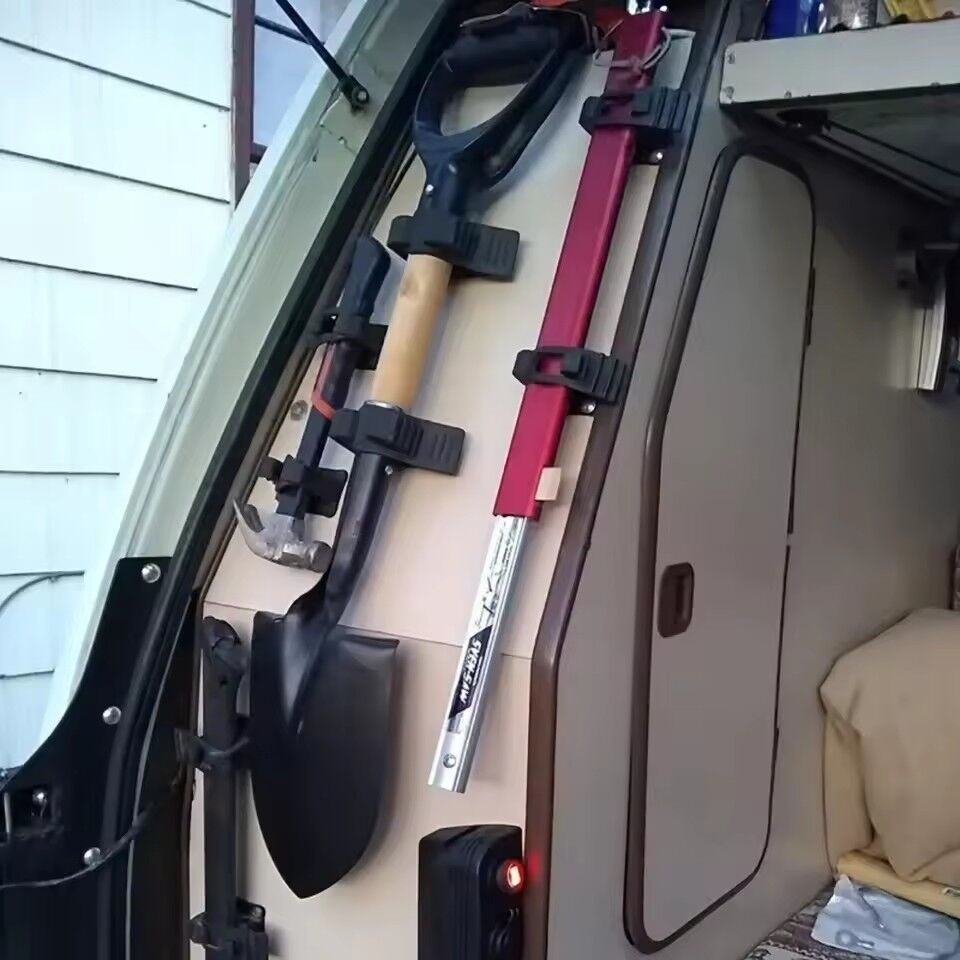 Rubber Grip Holding Shovel In 4wd Wagon