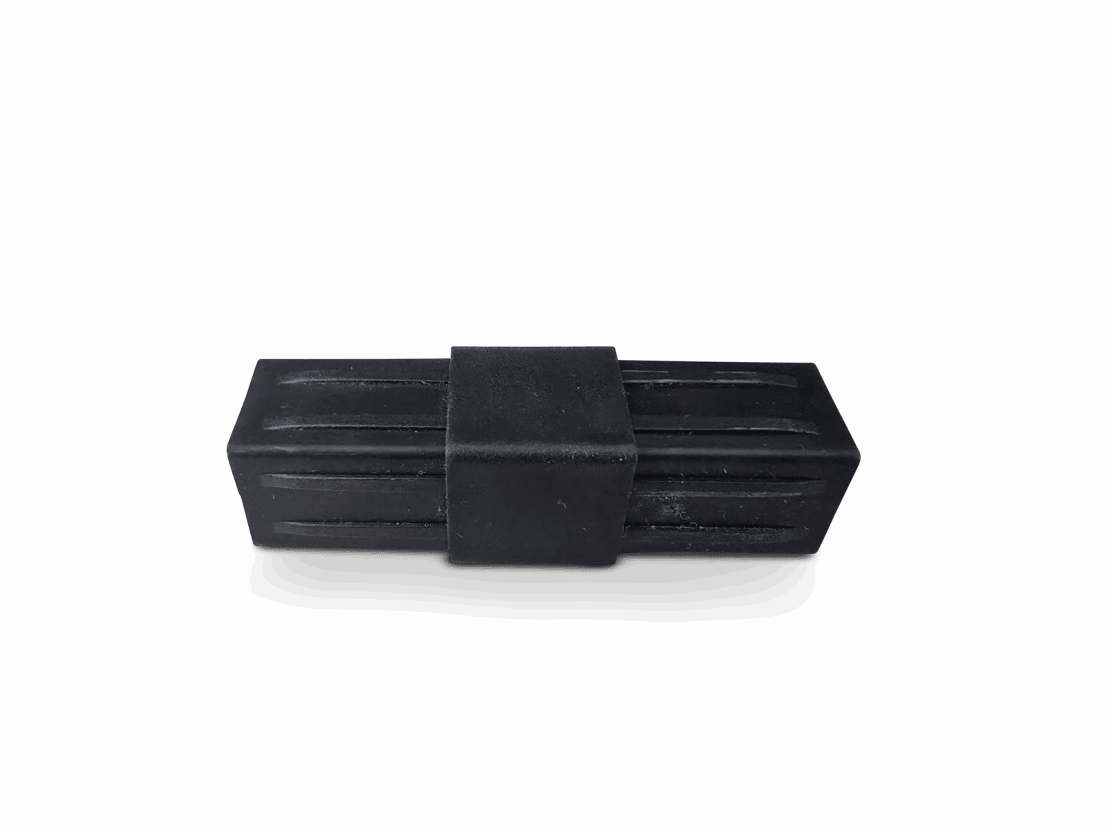 Small black plastic rectangle with central band and surface grooves.