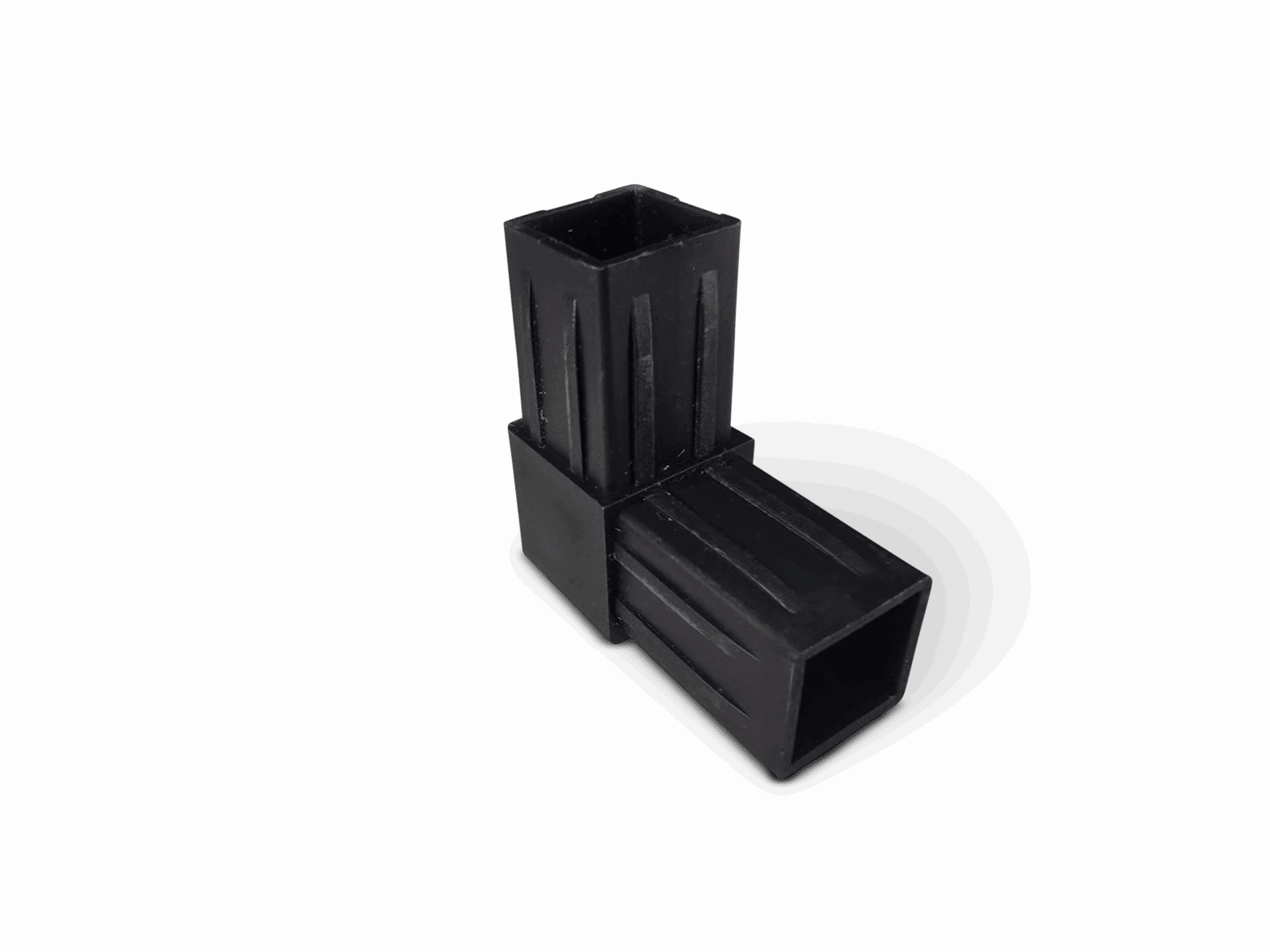 Black plastic T-joint with rectangular tube shape and vertical ridges.