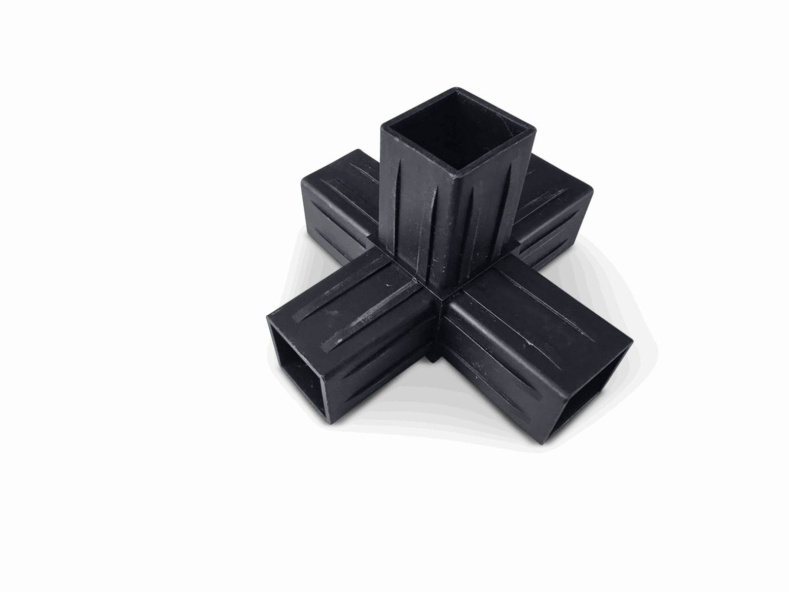 Black plastic cross-shaped connector with four hollow extensions on solid black background.
