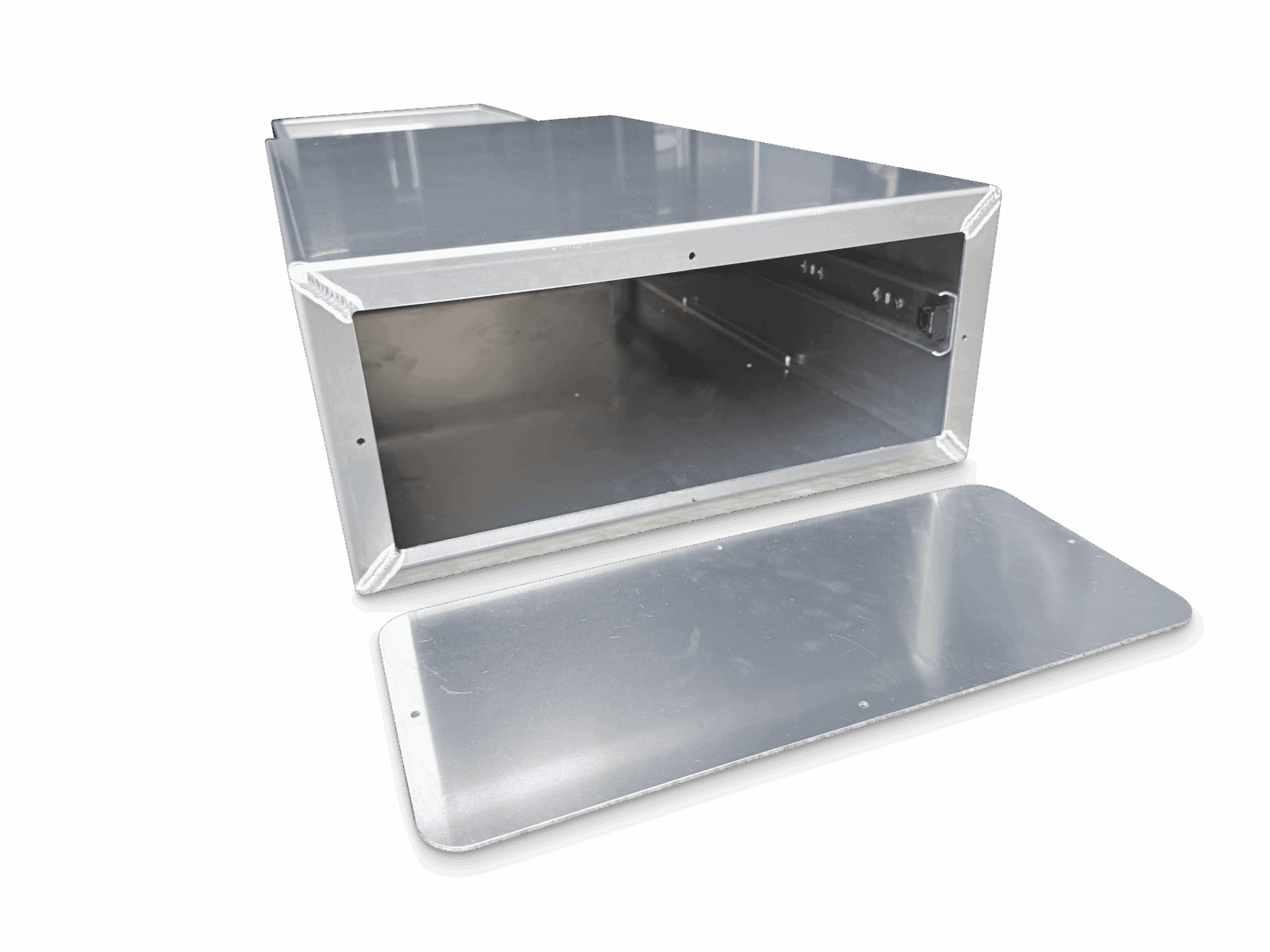 Rectangular open metal box with welded corners and flat removable metal panel on black background