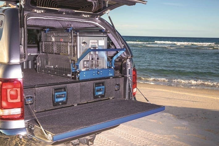 SUV With Electronic Gear On Beach