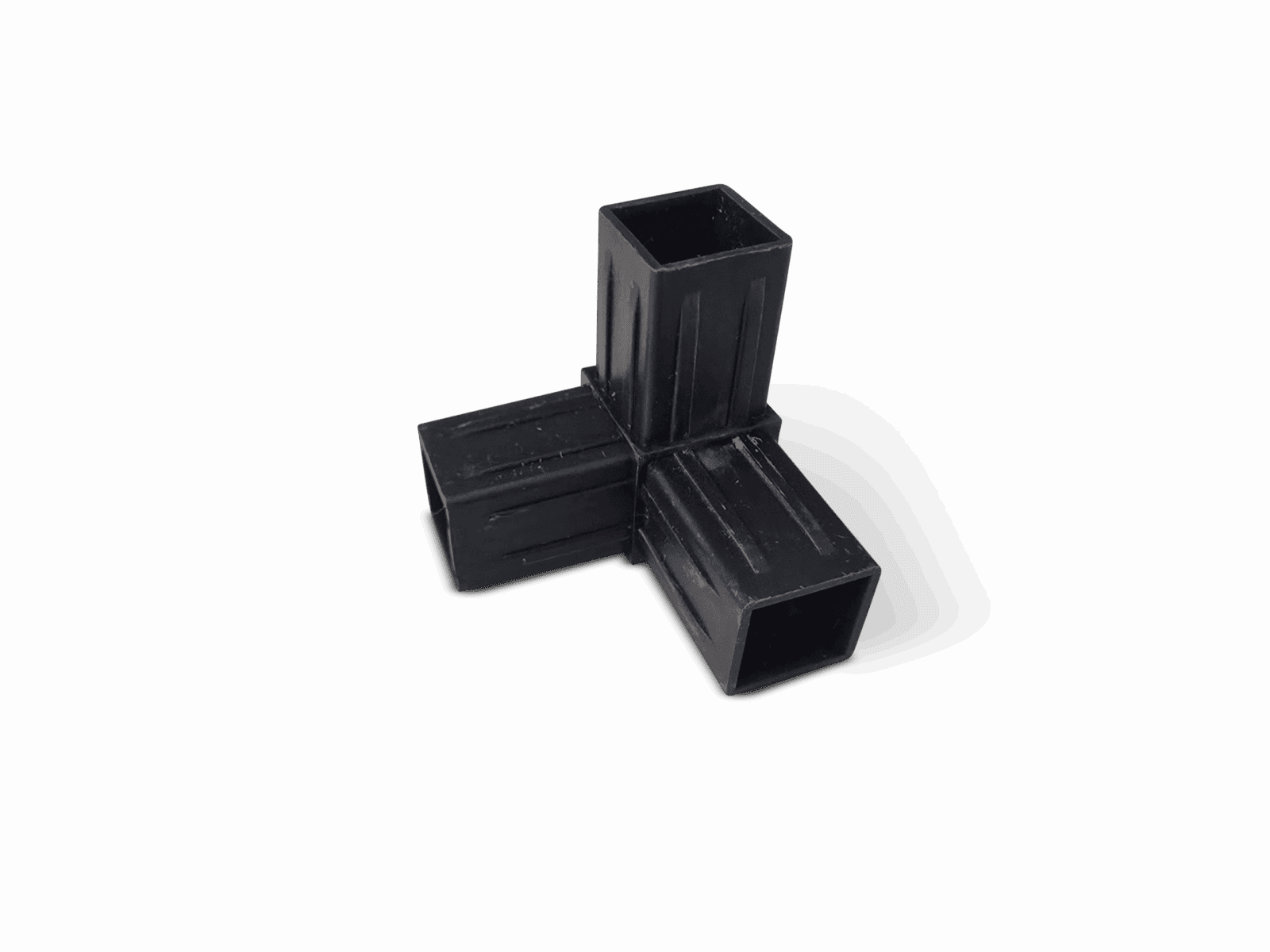 Black plastic connector with three hollow rectangular sockets at right angles.